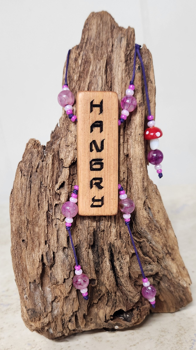 (image for) HANGRY This fun Bamboo Tile Necklace has donuts engraved on the back and a red and white mushroom charm!